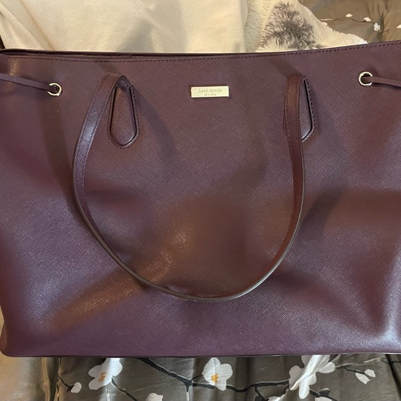 kate spade Handbags - kate spade wine colored leather tote with gold logo